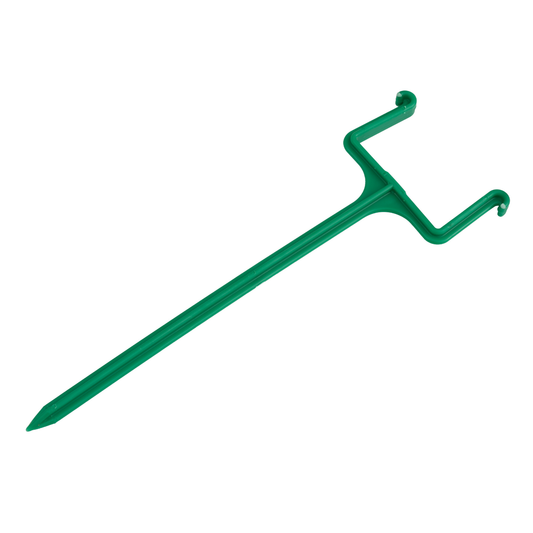 Green plastic downspout holder made of high-impact poly, anchors downspouts securely in place during all weather conditions